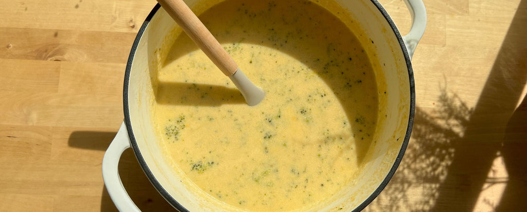 Broccoli Cheese Soup in a White Dutch Oven